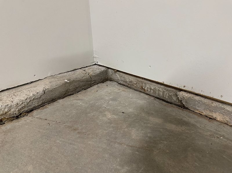 Basement wall bowing inward from lateral soil pressure